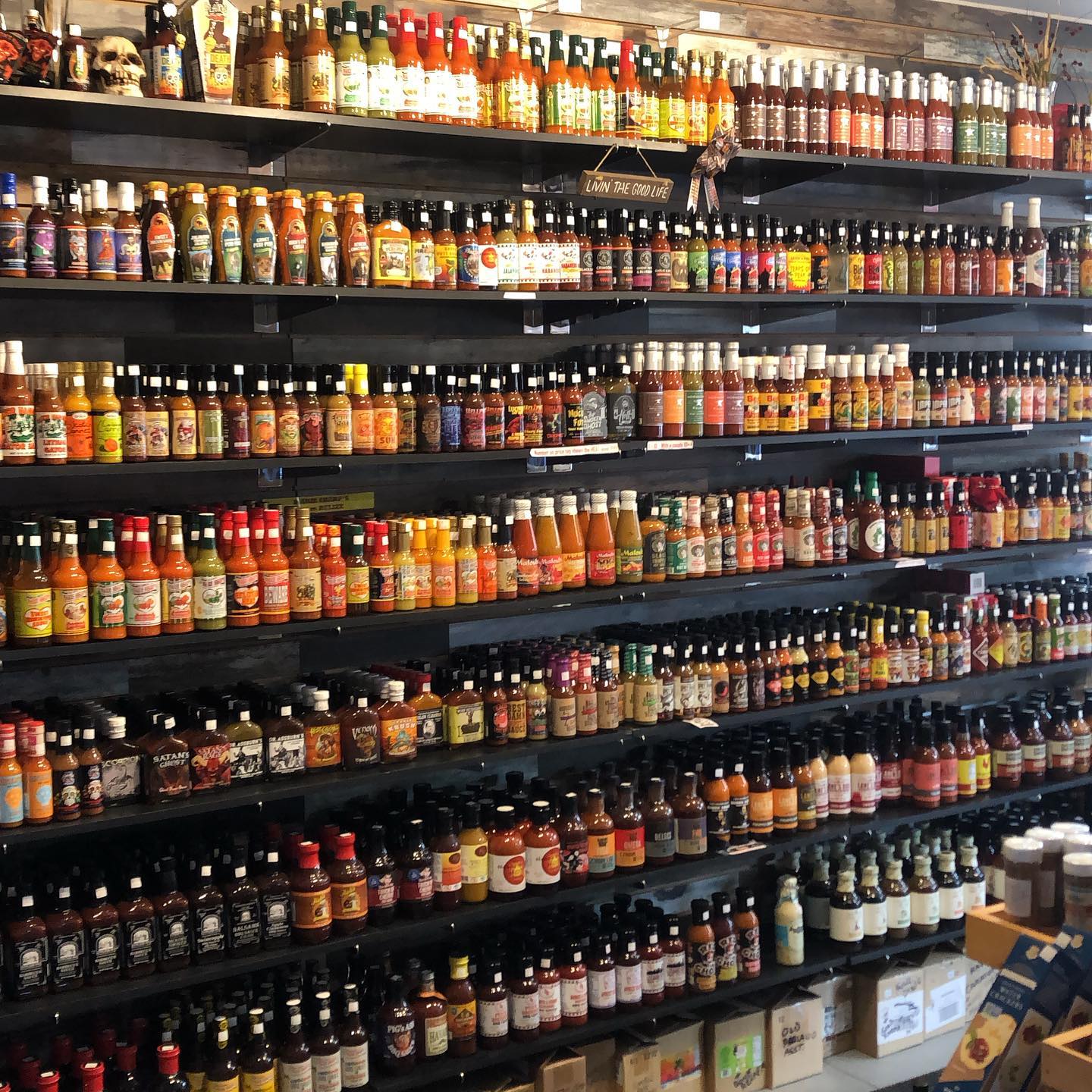 Wide variety of hot sauces on a shelf